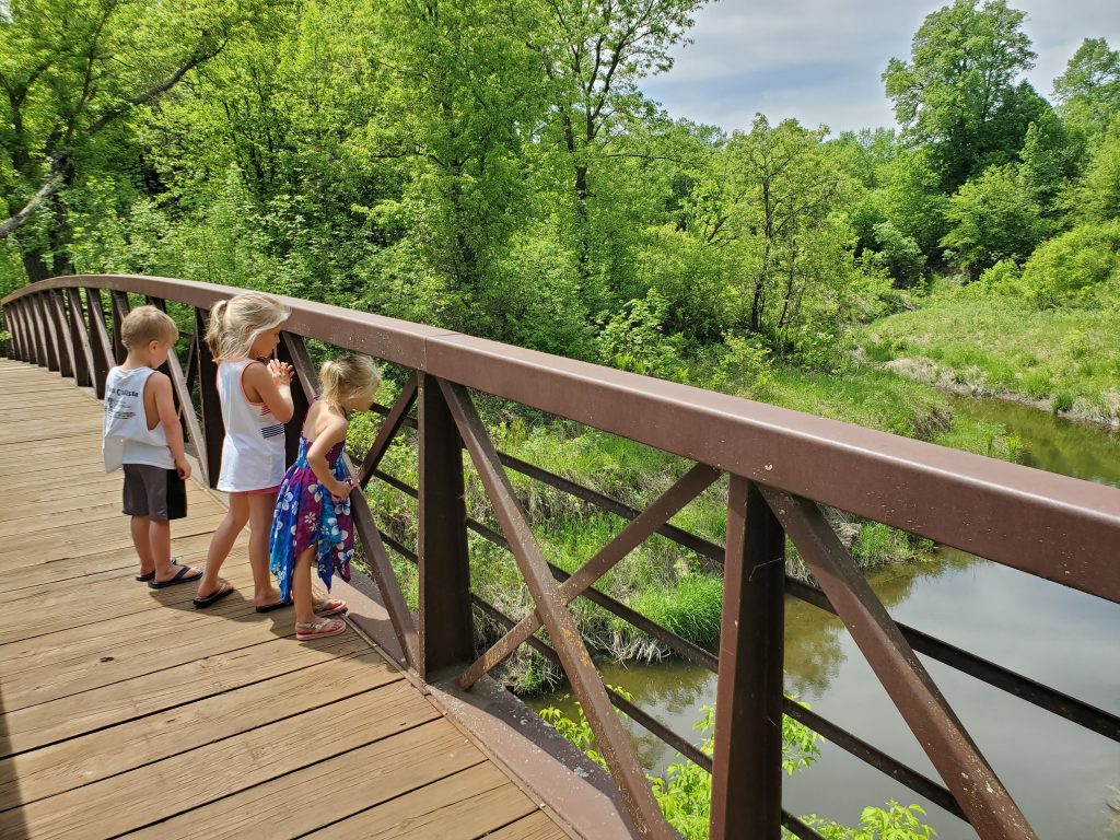 Children looking over a bridge at Icelandic State Park